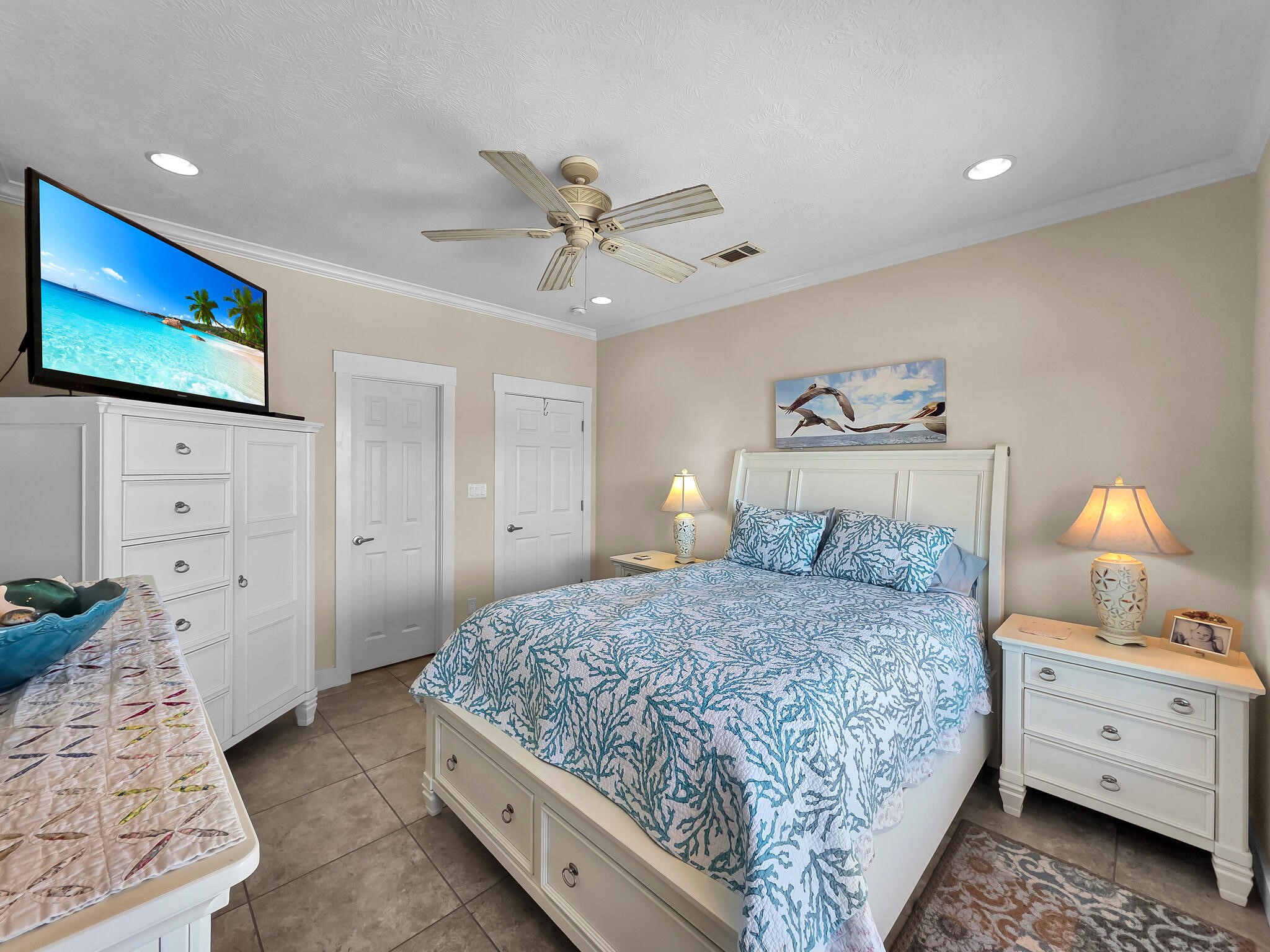 2383 Sandpiper Crystal Beach, TX 77650 - Photo 19 of 48 a bedroom with a bed and a flat screen tv