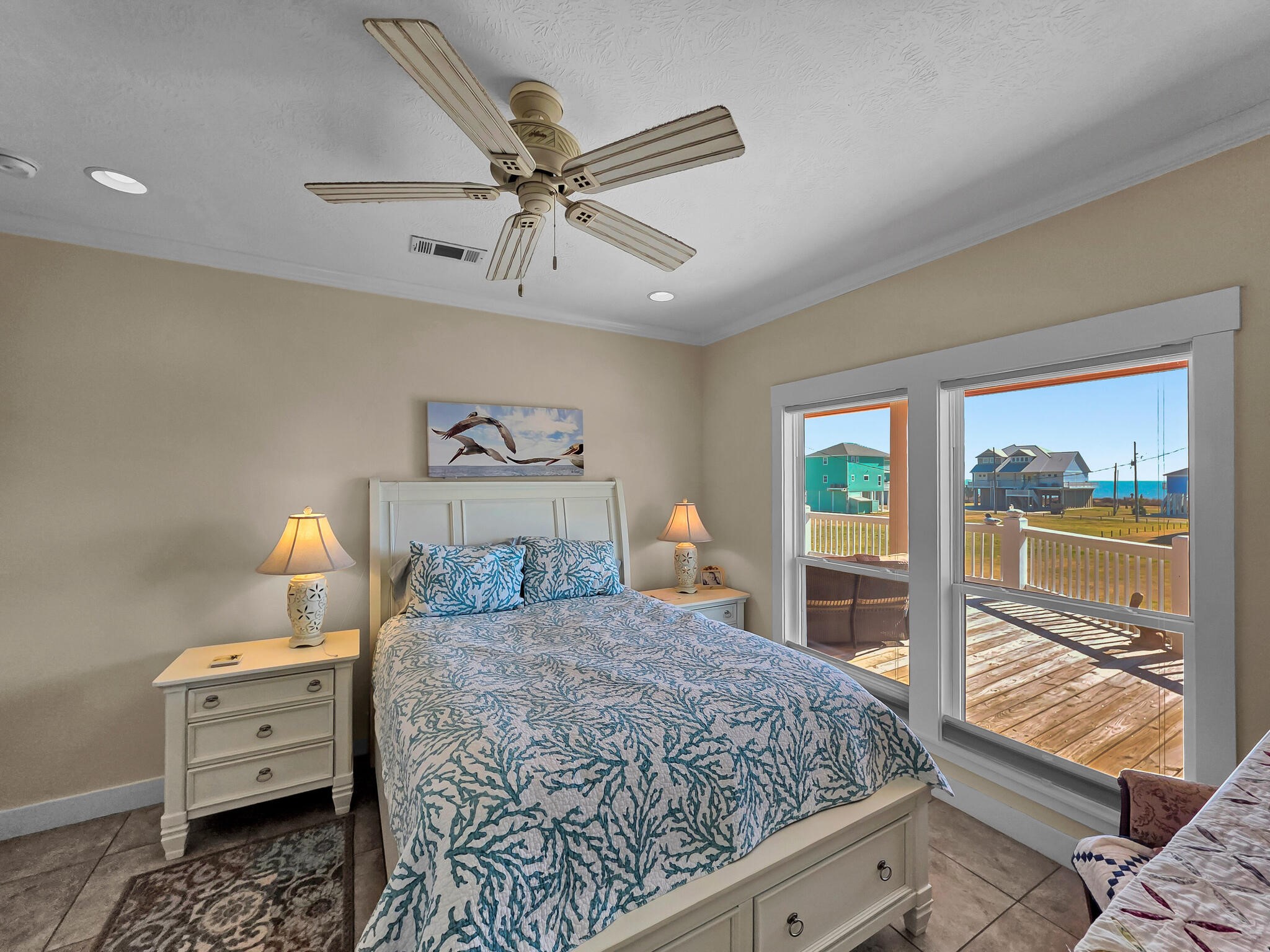 2383 Sandpiper Crystal Beach, TX 77650 - Photo 20 of 48 a bedroom with a large bed and a window