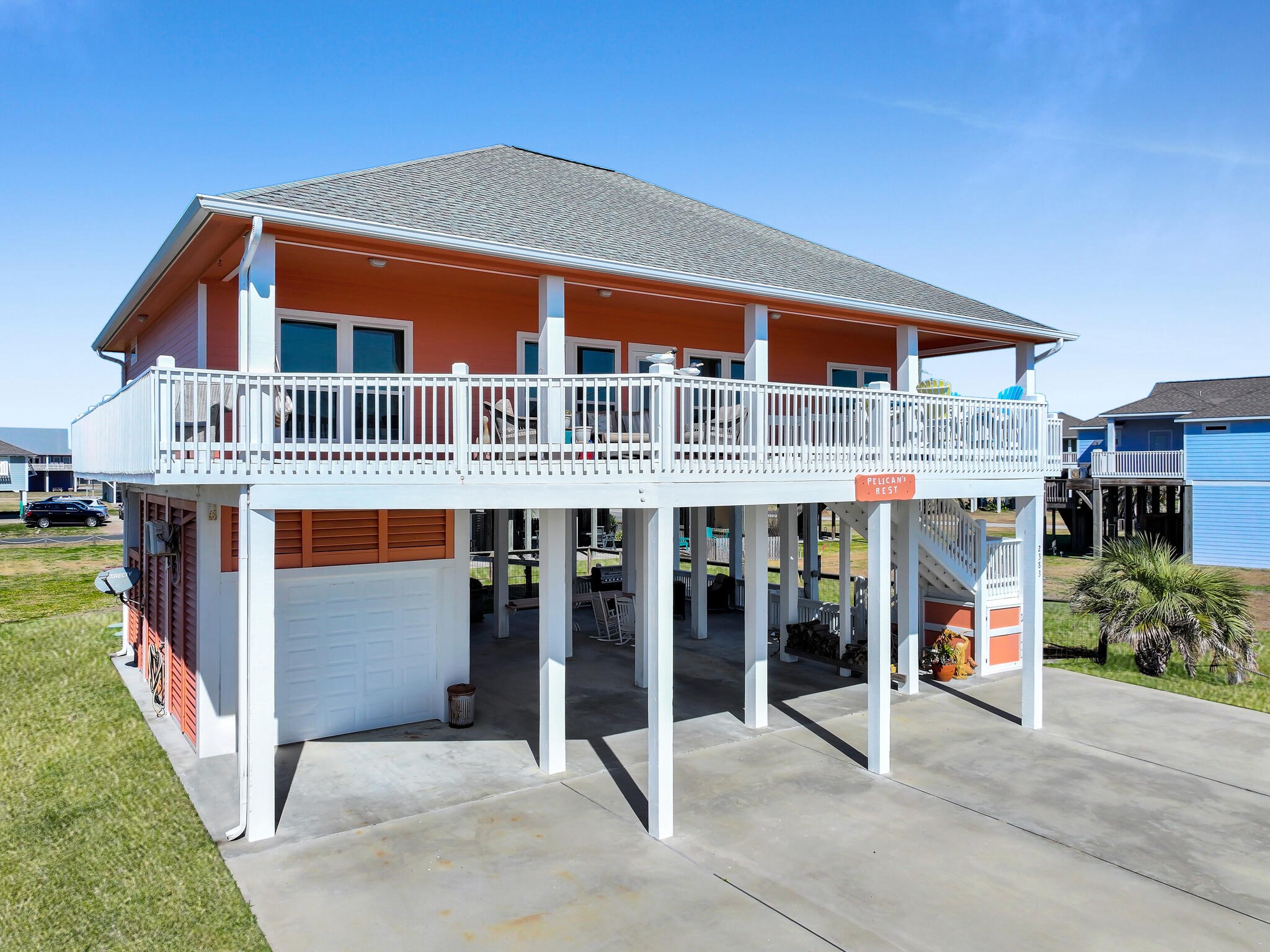 2383 Sandpiper Crystal Beach, TX 77650 - Photo 32 of 48 a front view of a building with glass windows