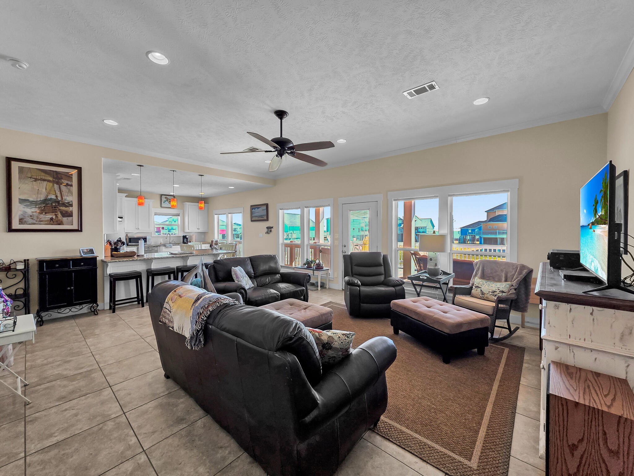 2383 Sandpiper Crystal Beach, TX 77650 - Photo 4 of 48 a living room with furniture and a flat screen tv