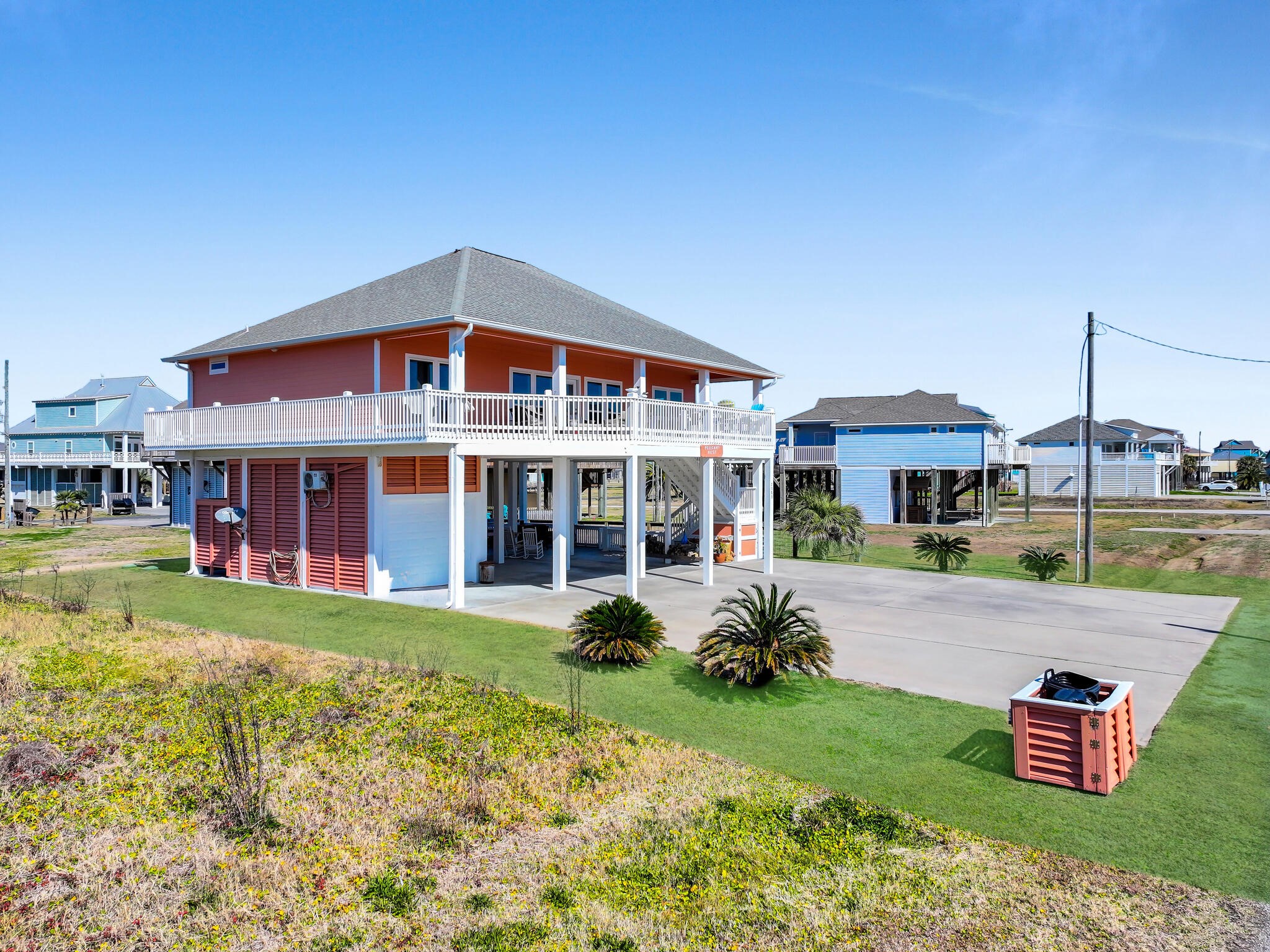 2383 Sandpiper Crystal Beach, TX 77650 - Photo 45 of 48 a front view of a house with garden