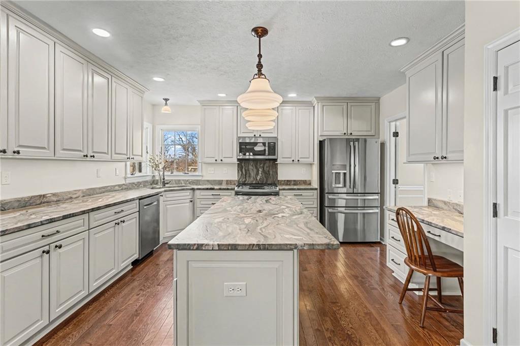 112 Field Club Circle McKees Rocks, PA 15136 - Photo 4 of 44 The stunning, leathered quartzite combined with the custom high-end cabinetry on this updated kitchen will certainly make this the heart of the home.
