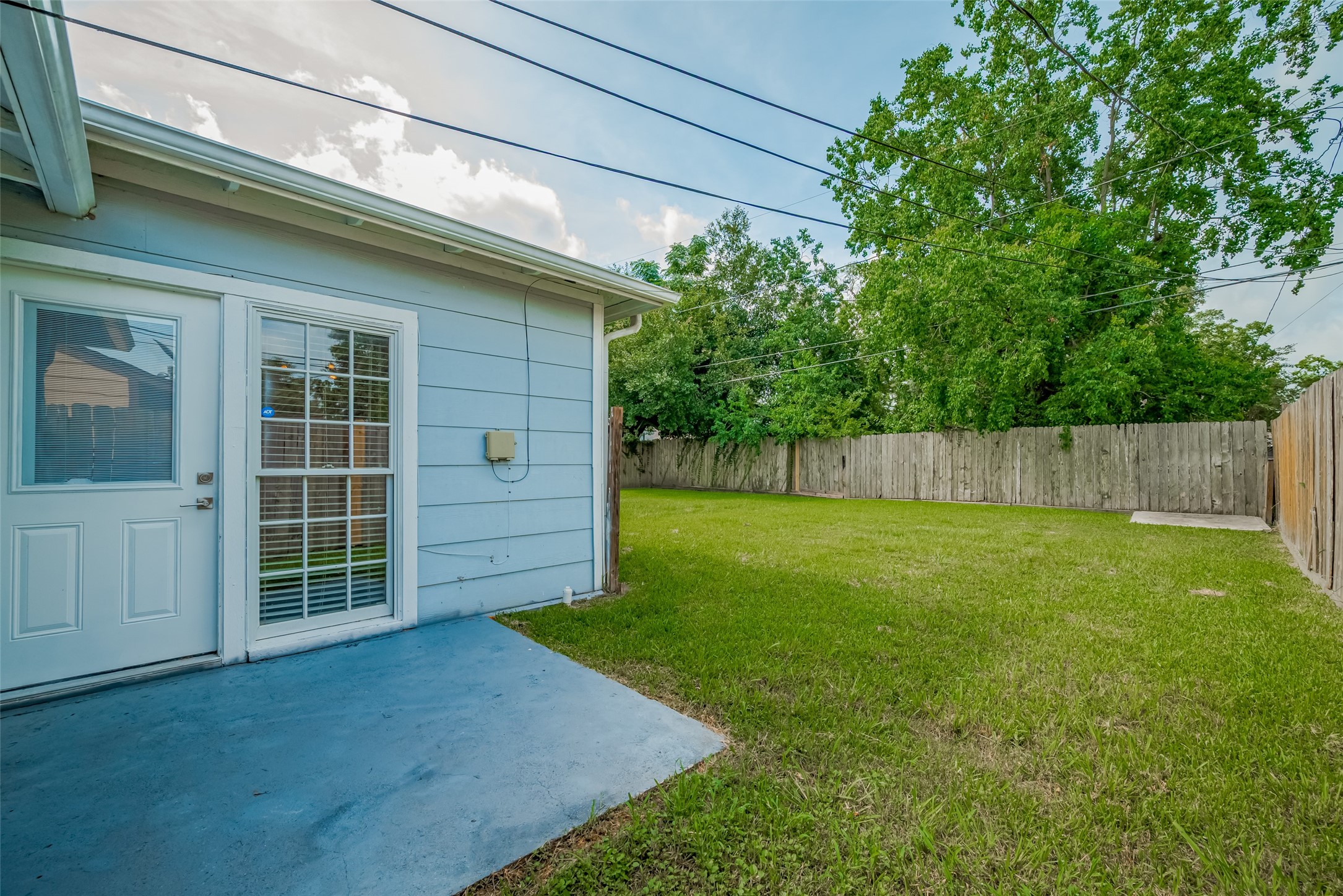 3930 Daphne Street Houston, TX 77021 - Photo 39 of 44 Step out onto a patio that transitions effortlessly into the backyard—perfect for relaxed evenings, alfresco dining, or just catching a quiet breeze.