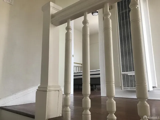 a room with a fireplace and a wooden floor