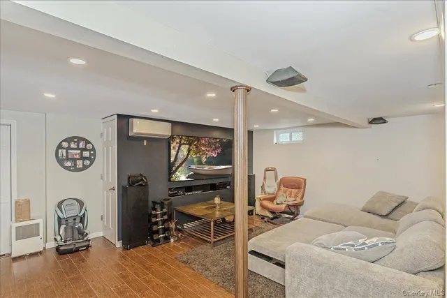 a bedroom with furniture and a gym equipment