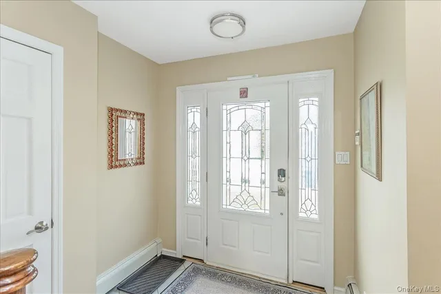a view of entryway with bathroom