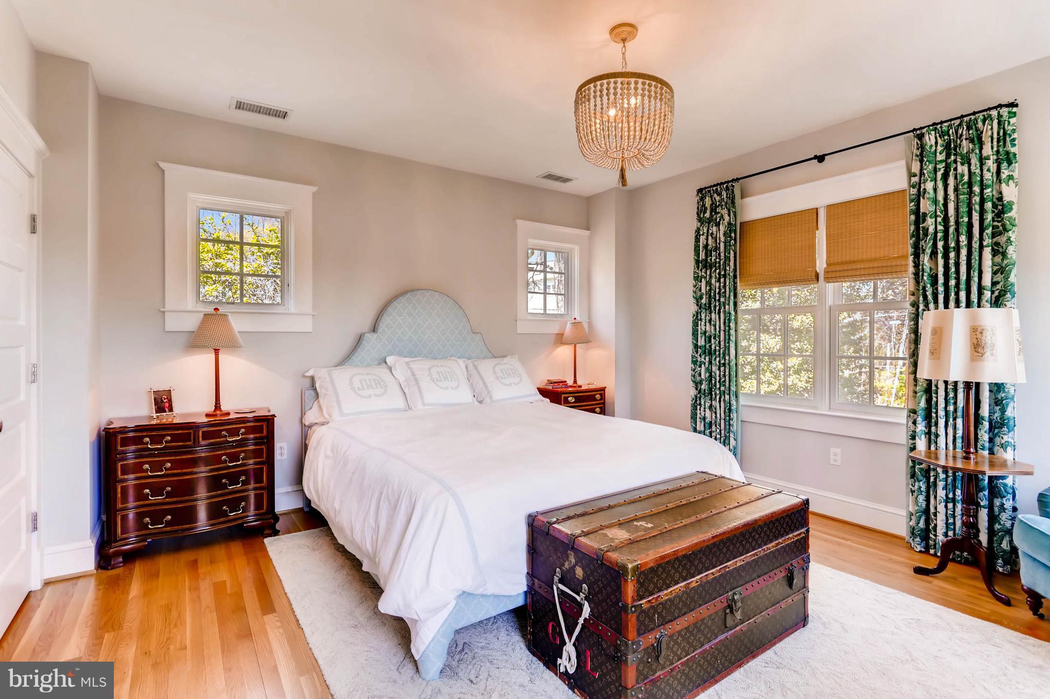 207 Oakdale Road Baltimore, MD 21210 - Photo 16 of 30 a bed room with a bed and a chandelier