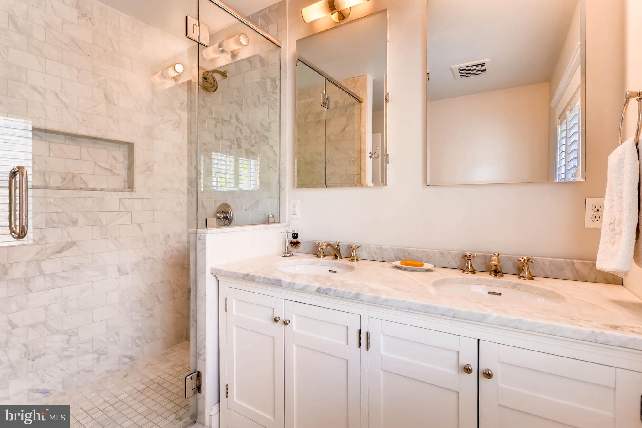 207 Oakdale Road Baltimore, MD 21210 - Photo 18 of 30 a bathroom with a sink and a mirror