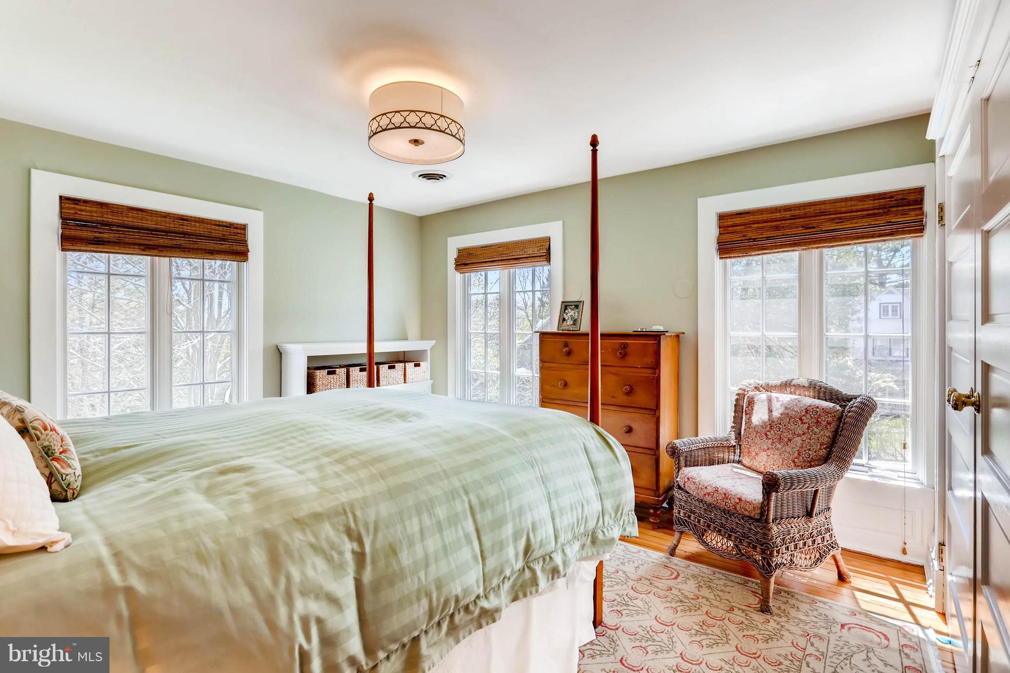 207 Oakdale Road Baltimore, MD 21210 - Photo 21 of 30 a bedroom with a bed and a chair
