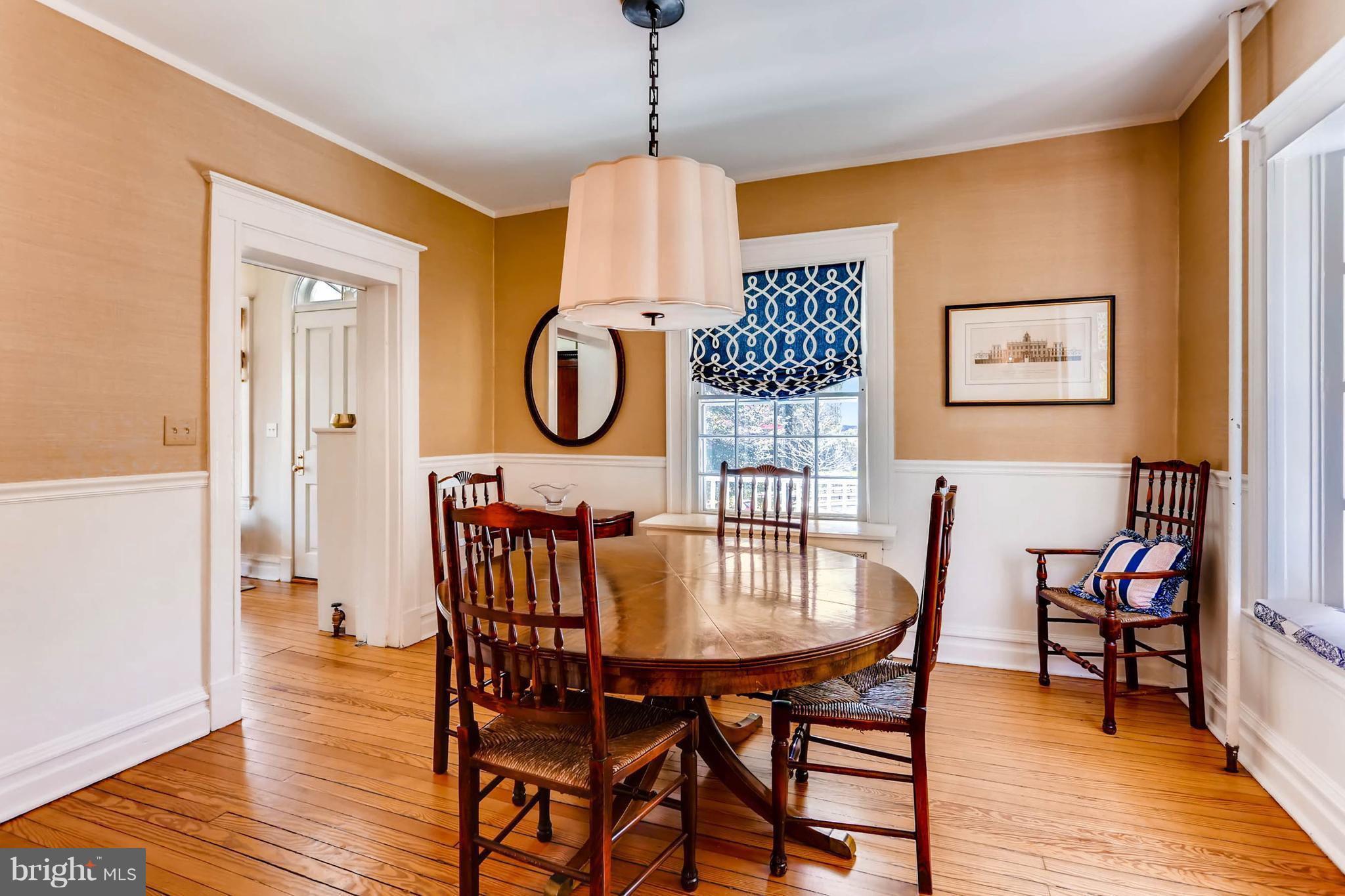 207 Oakdale Road Baltimore, MD 21210 - Photo 8 of 30 a dining room with furniture and wooden floor