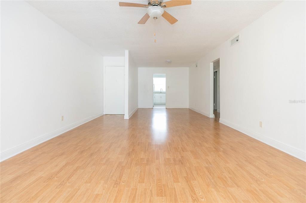 7531 Abonado Road, Unit 1 Tampa, FL 33615 - Photo 6 of 26 a view of empty room with wooden floor and fan