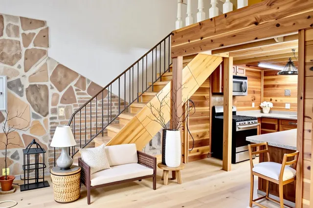 a front view of house with yard and trees around