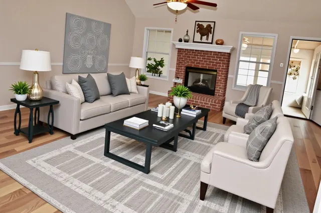 a kitchen with stainless steel appliances granite countertop a refrigerator a stove a sink dishwasher and white cabinets with wooden floor