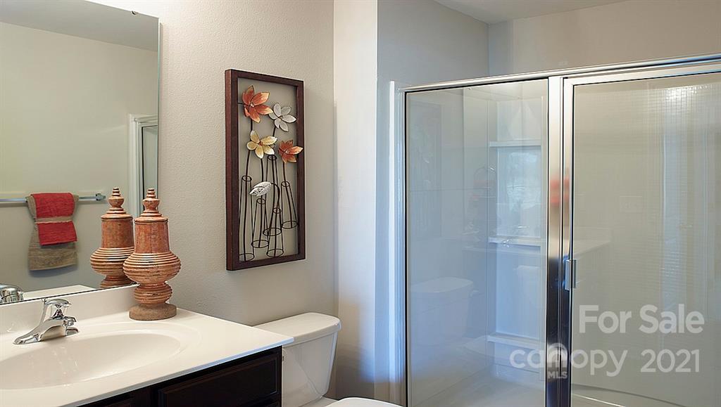 353 Gaines Road Clover, SC 29710 - Photo 8 of 48 a bathroom with a sink vanity and a mirror