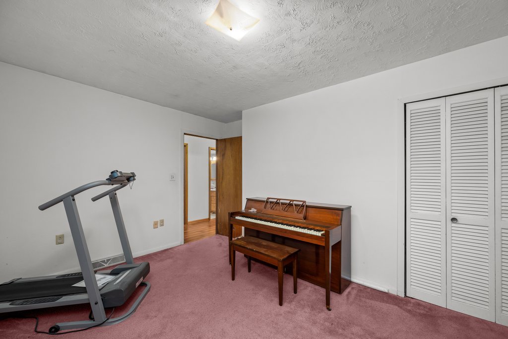 11213 22nd Street Milan, IL 61264 - Photo 11 of 36 a room with gym equipment