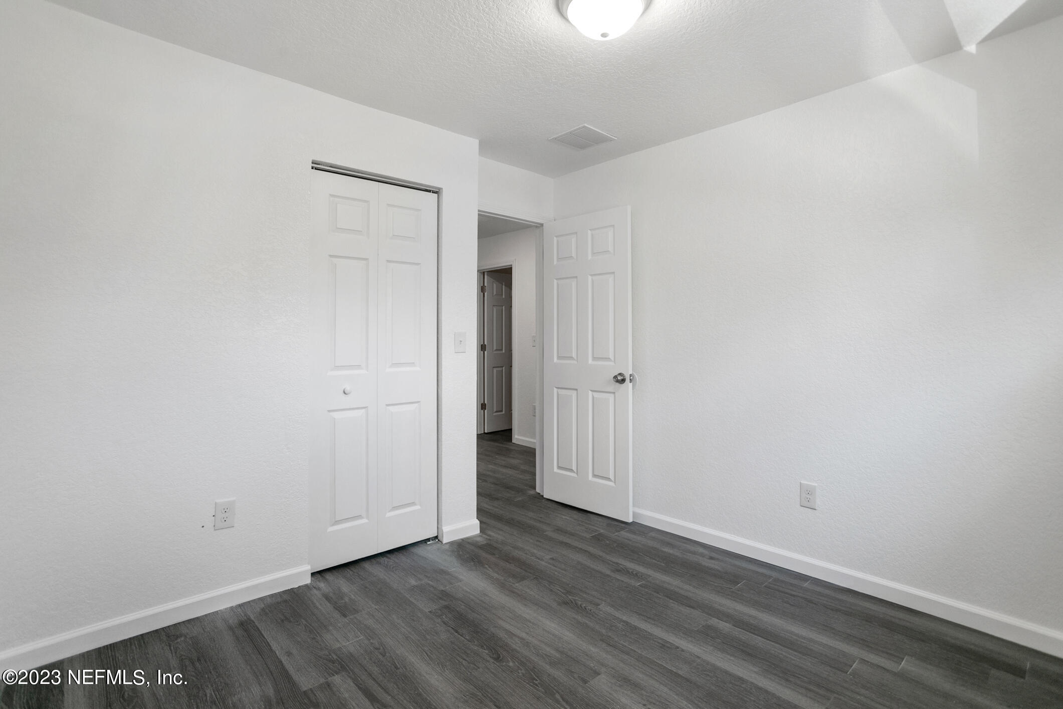 3616 Effee Street Jacksonville, FL 32209 - Photo 14 of 18 a view of an empty room with wooden floor and closet