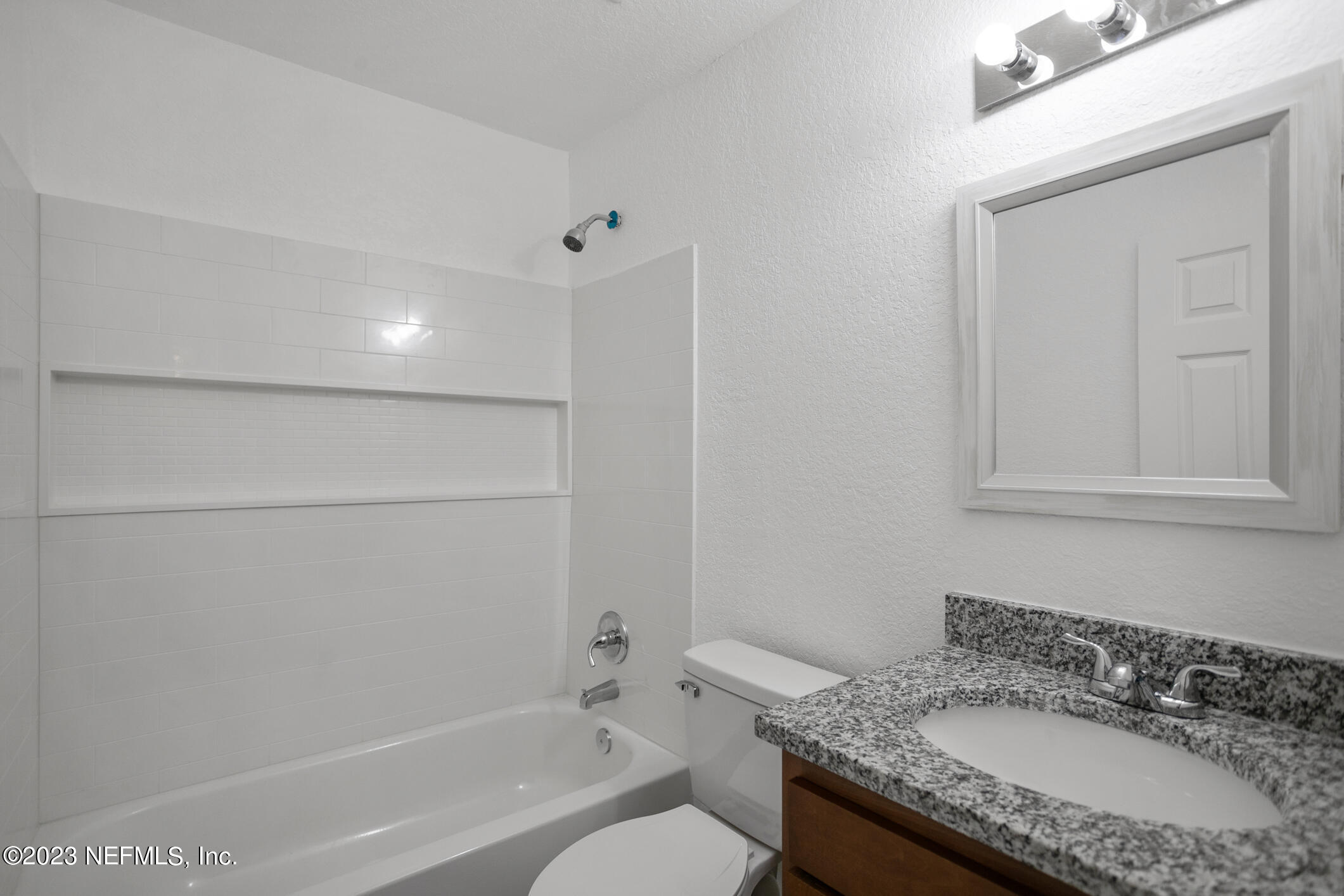 3616 Effee Street Jacksonville, FL 32209 - Photo 16 of 18 a bathroom with a granite countertop sink toilet and shower