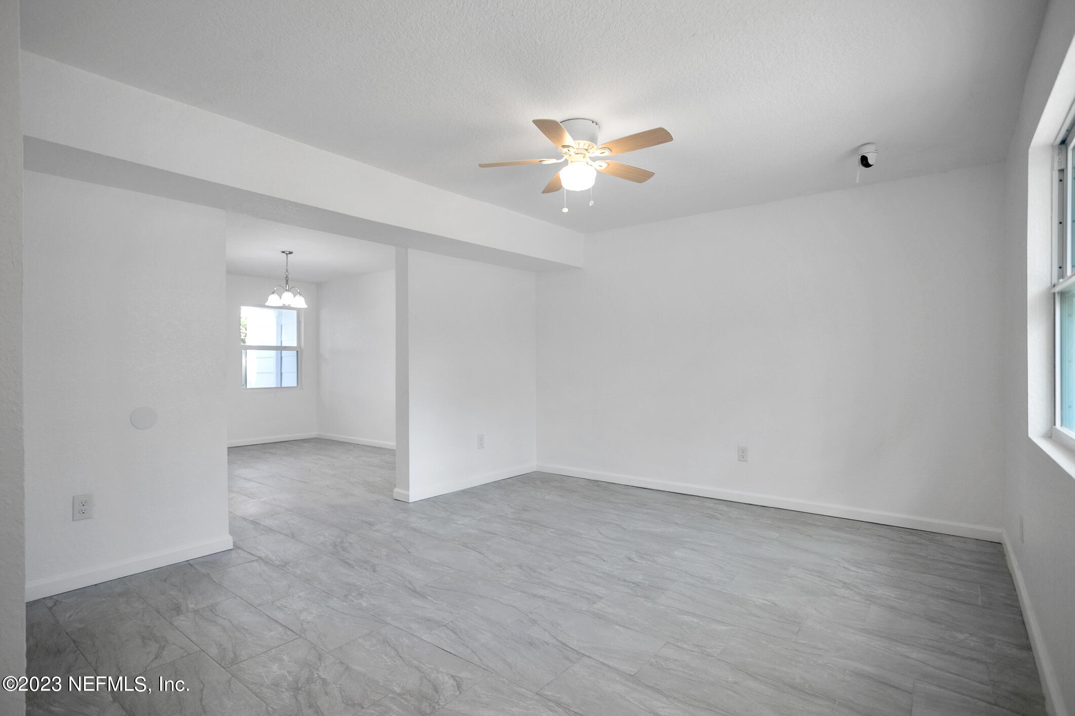 3616 Effee Street Jacksonville, FL 32209 - Photo 4 of 18 an empty room with windows and fan