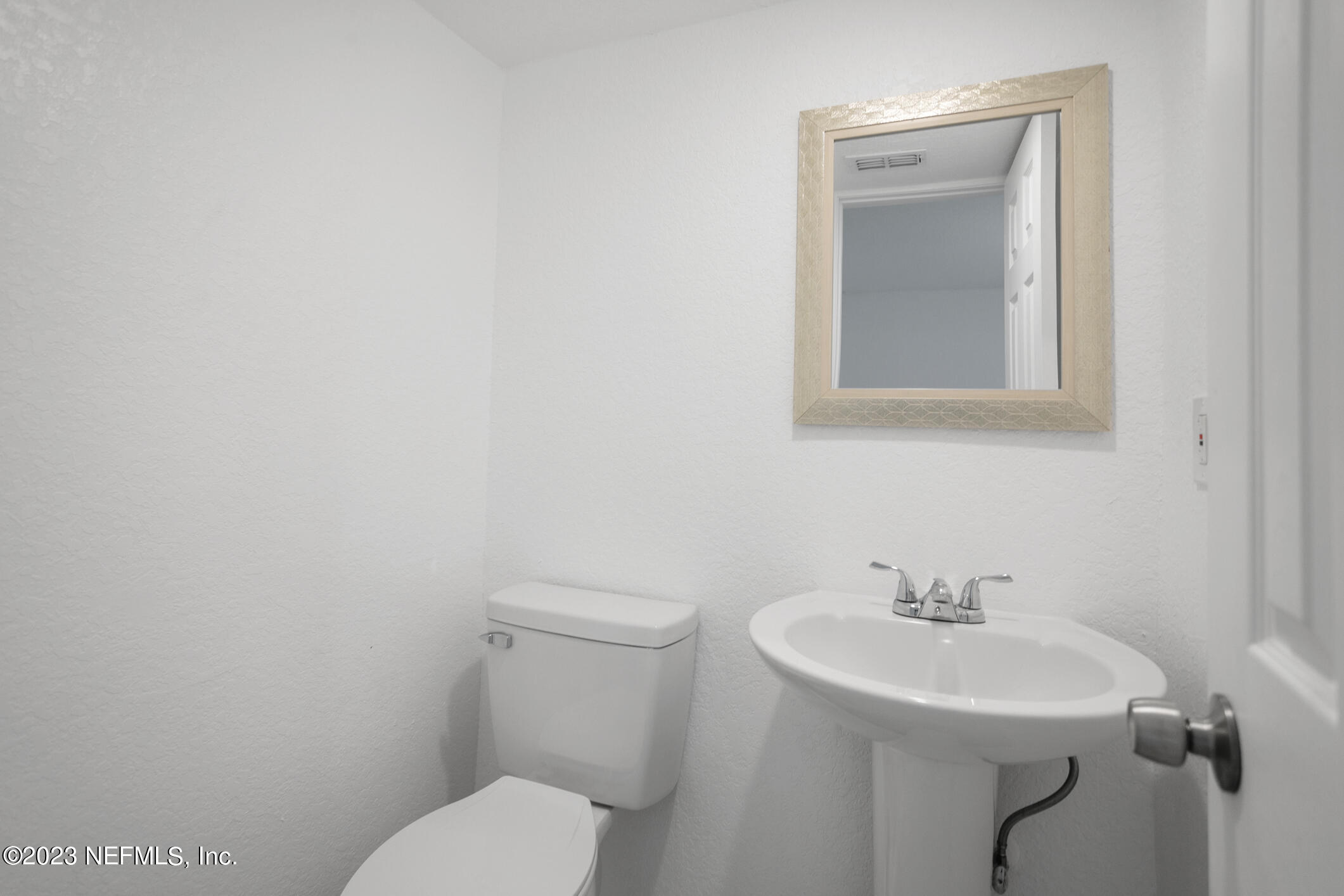 3616 Effee Street Jacksonville, FL 32209 - Photo 6 of 18 a bathroom with a toilet sink and mirror