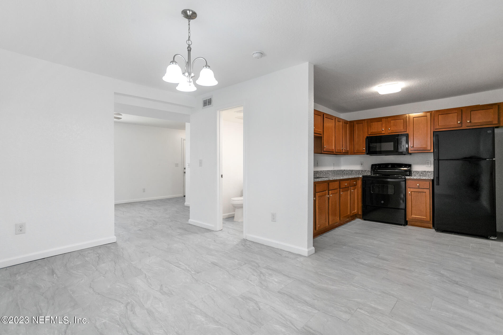 3616 Effee Street Jacksonville, FL 32209 - Photo 9 of 18 a view of a kitchen with a sink and stainless steel appliances
