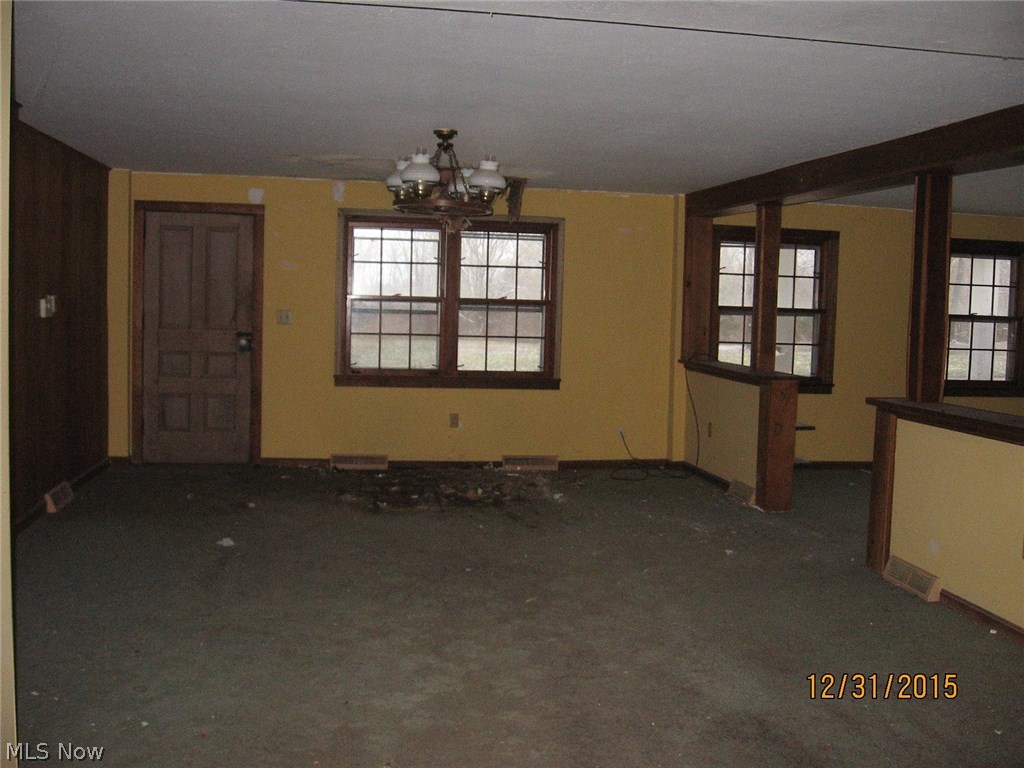 7230 South Ridge Road East Geneva, OH 44041 - Photo 5 of 24 Large room off kitchen could be used as a grand formal dining room with a living room to the right.