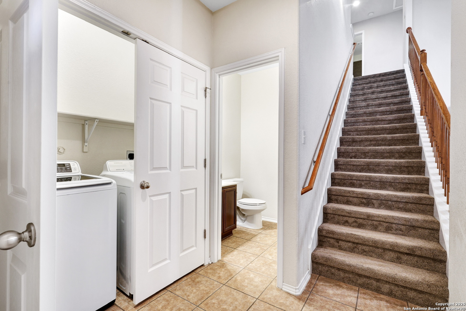 10410 Weser Lane Helotes, TX 78023 - Photo 20 of 22 a view of entryway with white walls and stairs