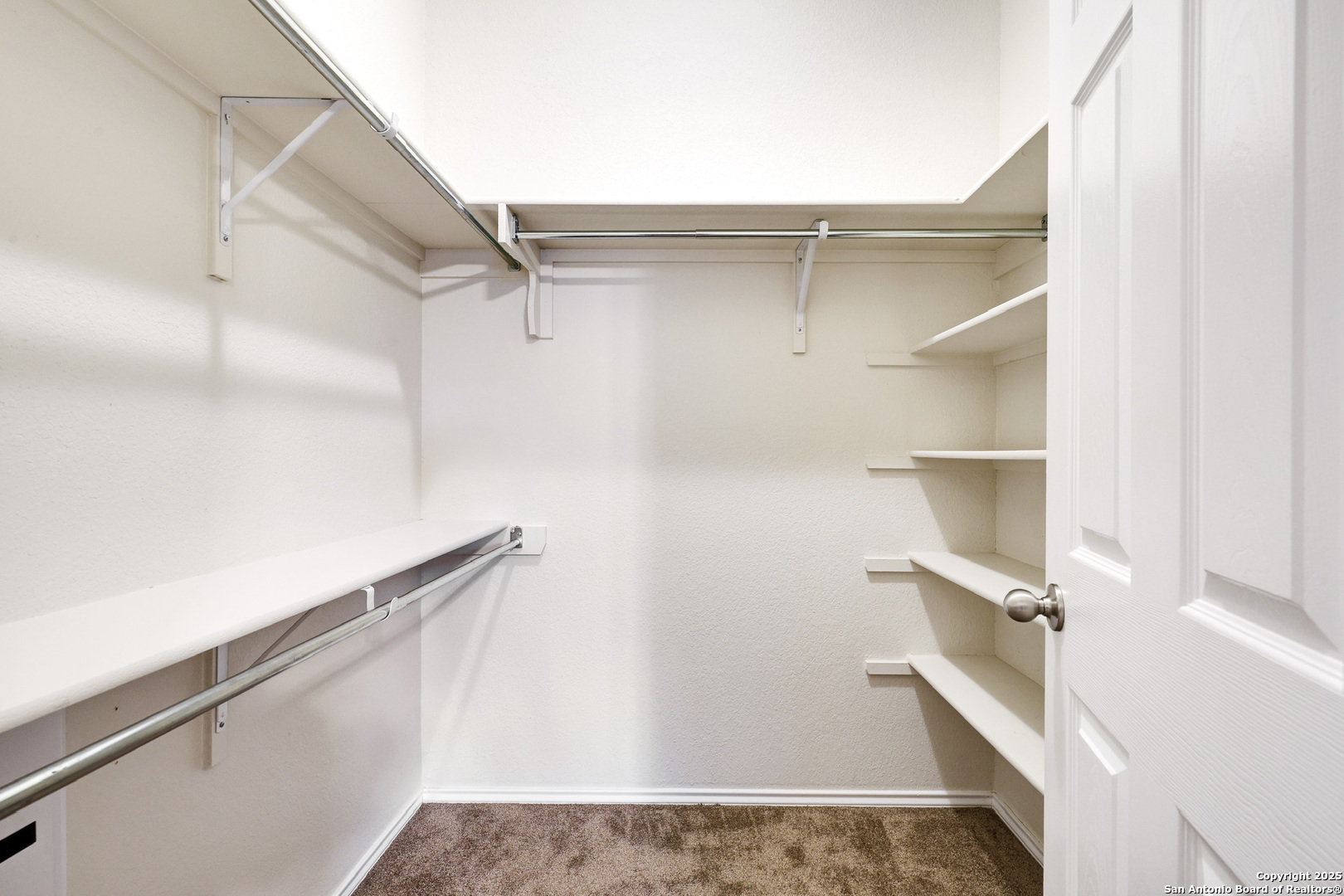 10410 Weser Lane Helotes, TX 78023 - Photo 21 of 22 a view of walk in closet with empty racks
