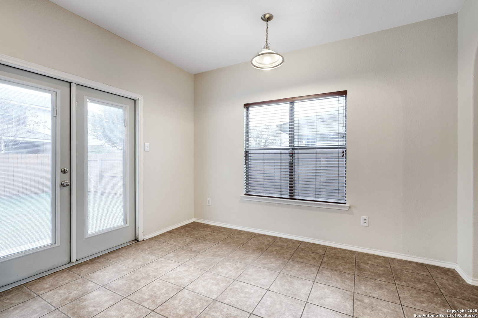 10410 Weser Lane Helotes, TX 78023 - Photo 9 of 22 an empty room with windows