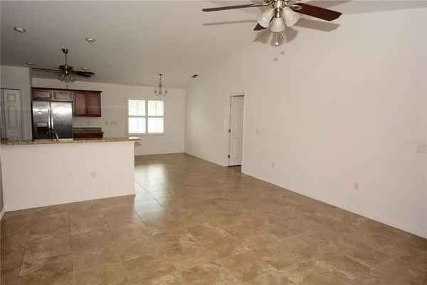 a kitchen with stainless steel appliances granite countertop a stove microwave and sink