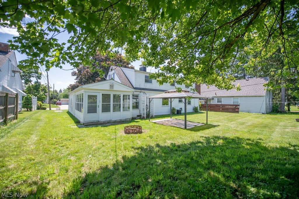4221 2nd Street Northwest Canton, OH 44708 - Photo 4 of 35 Back exterior featuring 3 season sun room