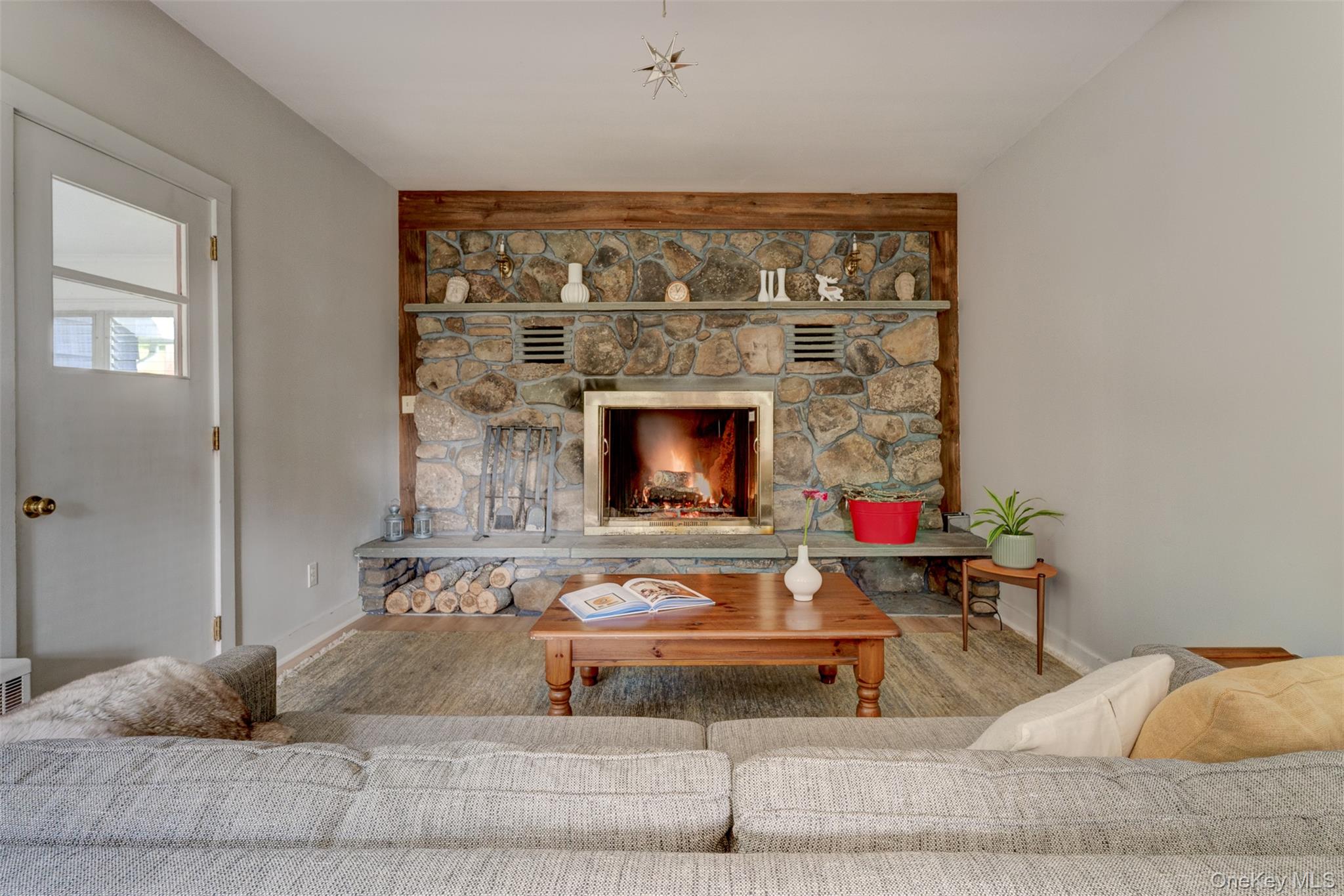 578 Bethlehem Road Callicoon Center, NY 12724 - Photo 12 of 39 a living room with furniture and a fireplace