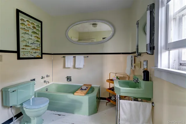 a bathroom with a bathtub and shower