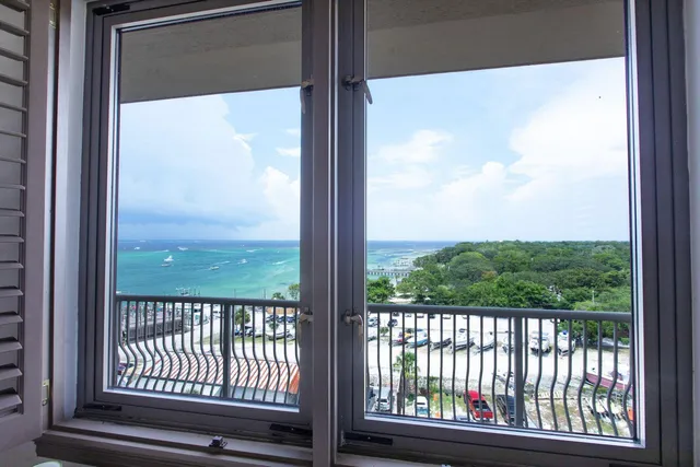 a view of a glass door and a balcony