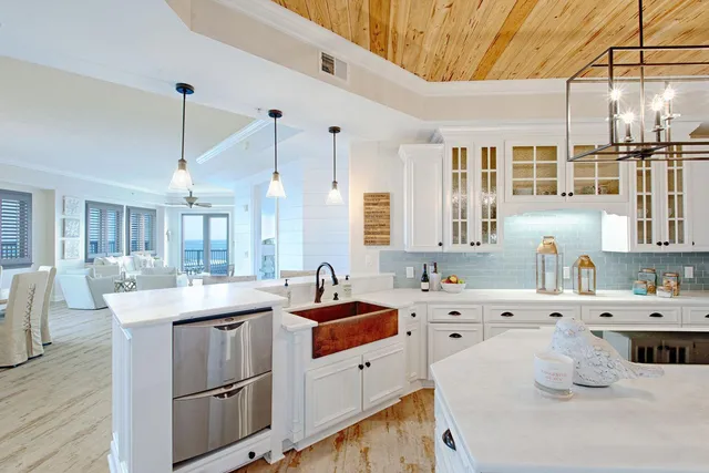 a kitchen with a sink stove and cabinets
