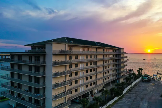 a front view of a building with a yard