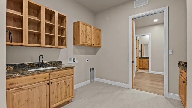 a kitchen with stainless steel appliances granite countertop a stove and a refrigerator