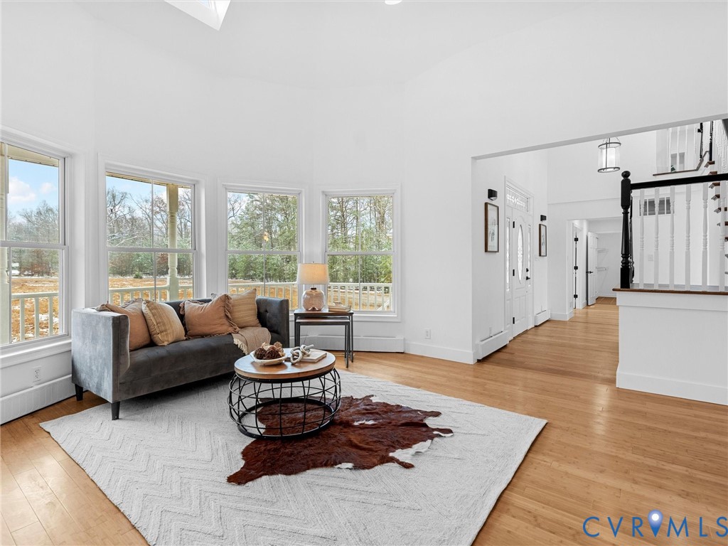 5117 Byrd Mill Road Louisa, VA 23093 - Photo 11 of 50 Living area featuring light wood-style floors, a t