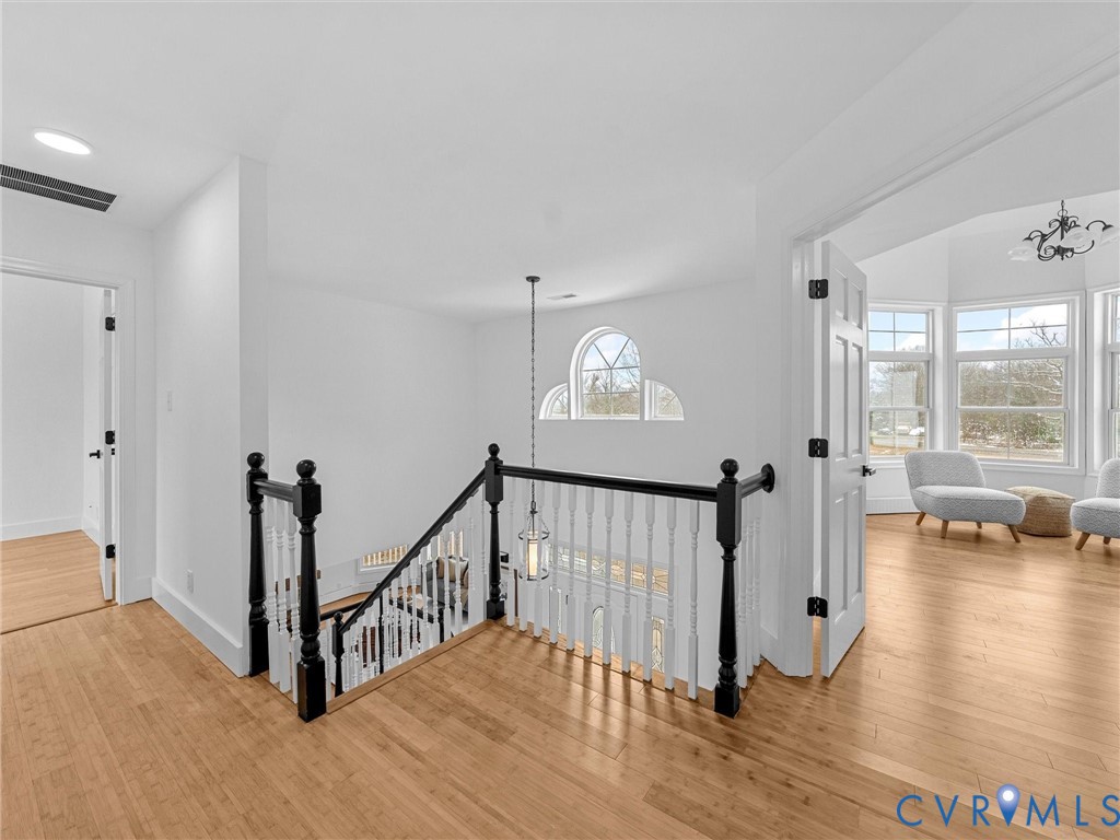 5117 Byrd Mill Road Louisa, VA 23093 - Photo 27 of 50 Hallway with a chandelier, an upstairs landing, an