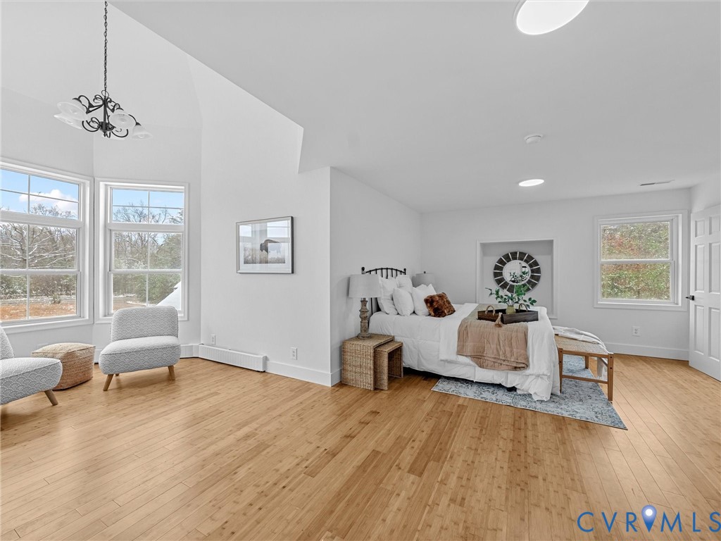 5117 Byrd Mill Road Louisa, VA 23093 - Photo 28 of 50 Bedroom with light wood-type flooring, a high ceil