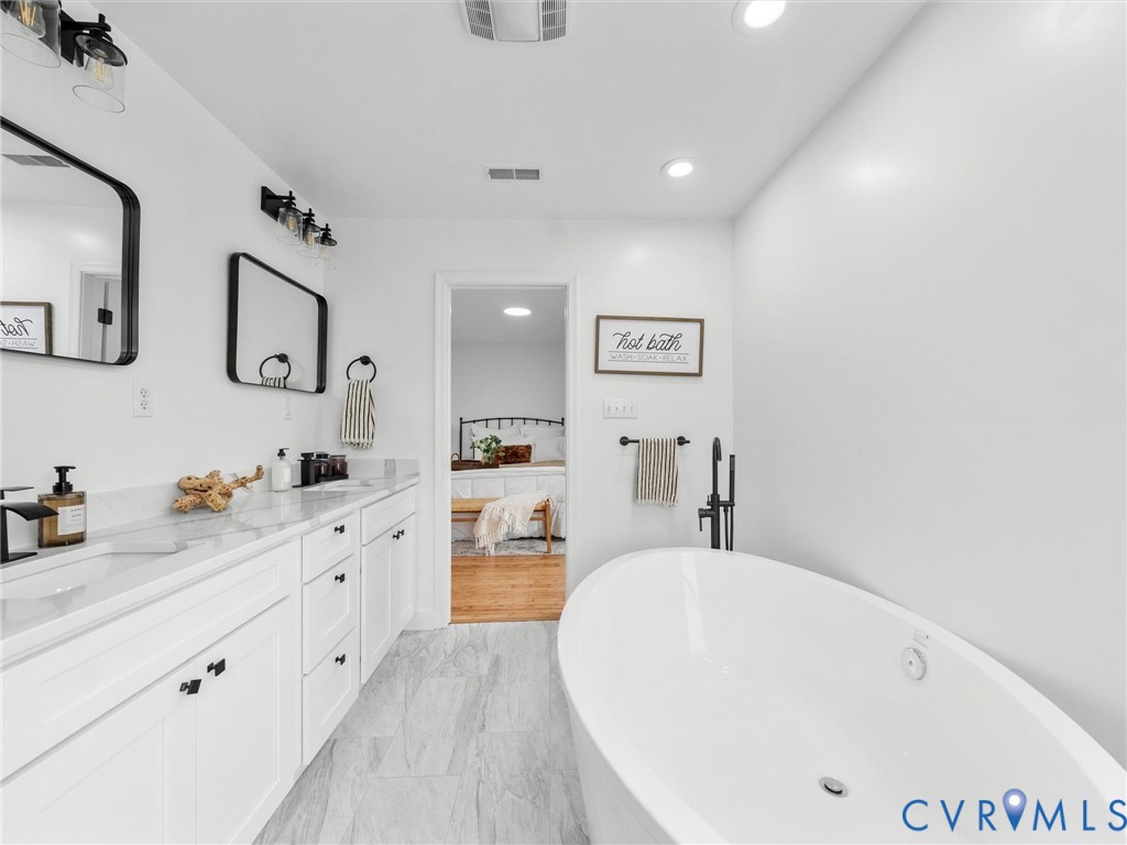 5117 Byrd Mill Road Louisa, VA 23093 - Photo 37 of 50 Full bathroom featuring double vanity, a freestand