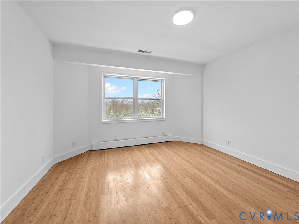 5117 Byrd Mill Road Louisa, VA 23093 - Photo 39 of 50 Spare room featuring light wood-style floors and b