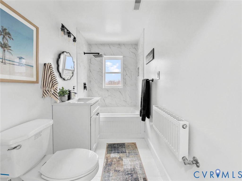 5117 Byrd Mill Road Louisa, VA 23093 - Photo 41 of 50 Full bathroom with vanity, radiator, and tub / sho