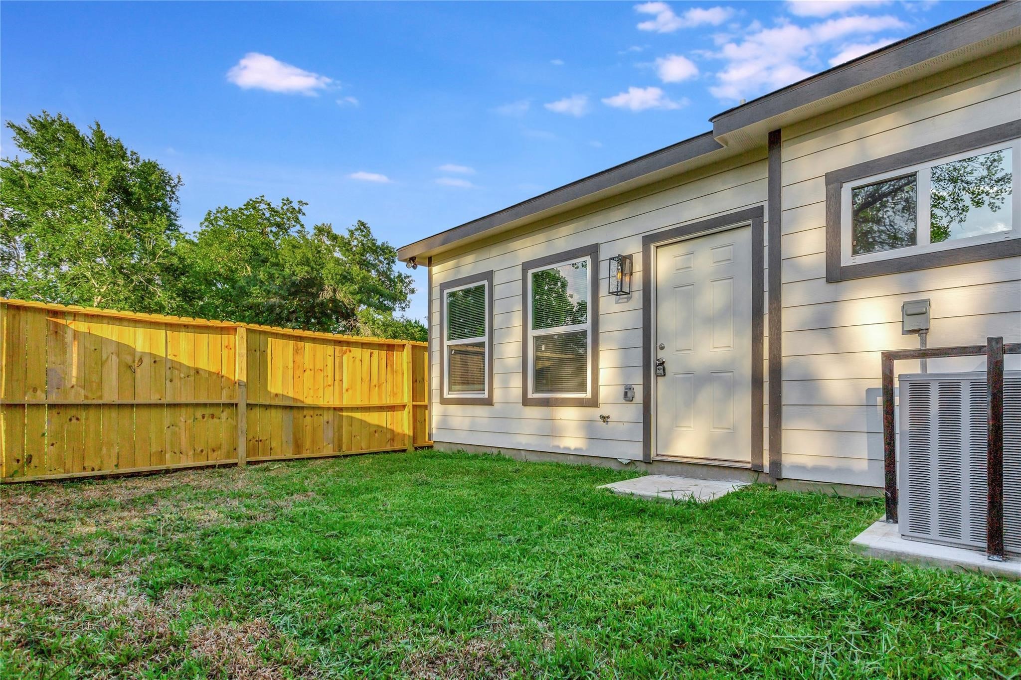 6813 Liverpool Street, Unit B Houston, TX 77021 - Photo 9 of 9 Private fenced yard with lush grass and mature shade trees