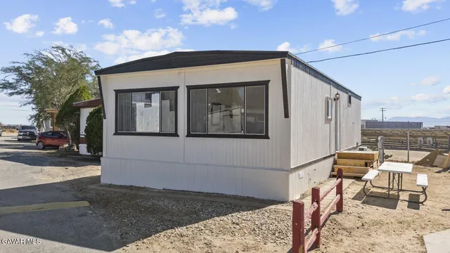 a front view of a house with many windows