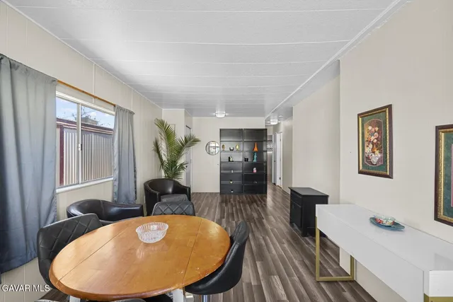 a view of a livingroom with furniture and staircase