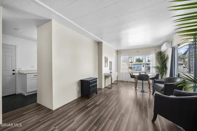 a view of a dining room with furniture window and outside view