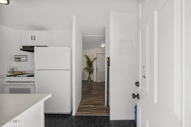 a room with furniture and white doors