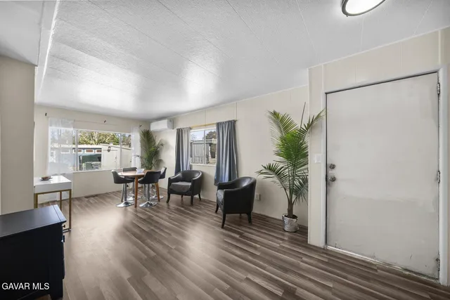 a view of a livingroom with furniture and window
