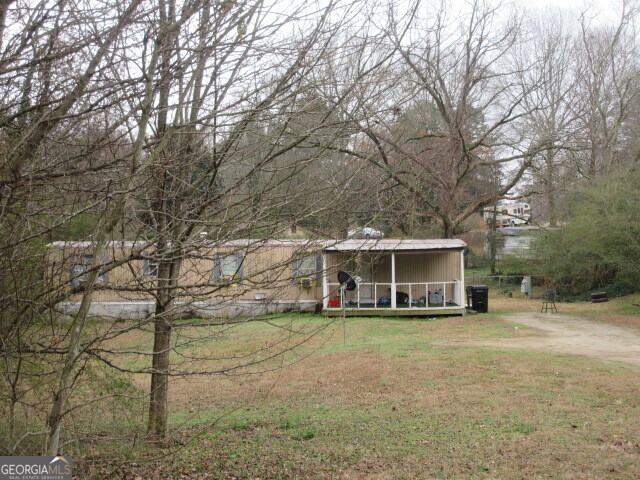 140 Millers Mill Road Stockbridge, GA 30281 - Photo 1 of 3 a view of a house with a yard