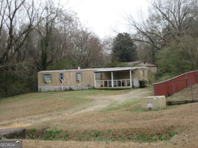 140 Millers Mill Road Stockbridge, GA 30281 - Photo 2 of 3 a view of a house with a backyard